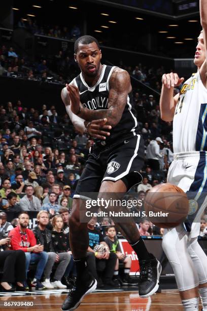 Spencer Dinwiddie of the Brooklyn Nets passes the ball against the Denver Nuggets on October 29, 2017 at Barclays Center in Brooklyn, New York. NOTE...