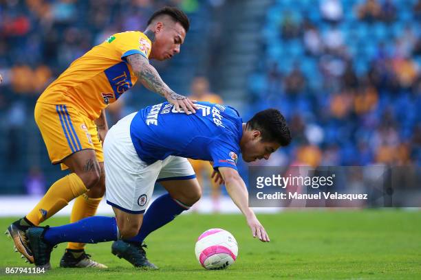 Francisco Silva of Cruz Azul struggles for the ball against Eduardo Vargas of Tigres during the 15th round match between Cruz Azul and Tigres UANL as...