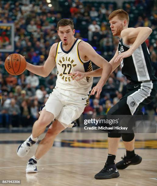 Leaf of the Indiana Pacers drives to the basket against Davis Bertans of the San Antonio Spurs at Bankers Life Fieldhouse on October 29, 2017 in...