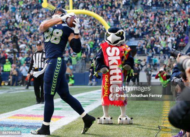 Tight end Jimmy Graham of the Seattle Seahawks celebrates his 1 yard touchdown during the fourth quarter of the game against the Houston Texans at...