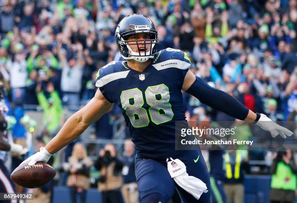 Tight end Jimmy Graham of the Seattle Seahawks celebrates a touchdown with 21 seconds left in the game against the Houston Texans at CenturyLink...