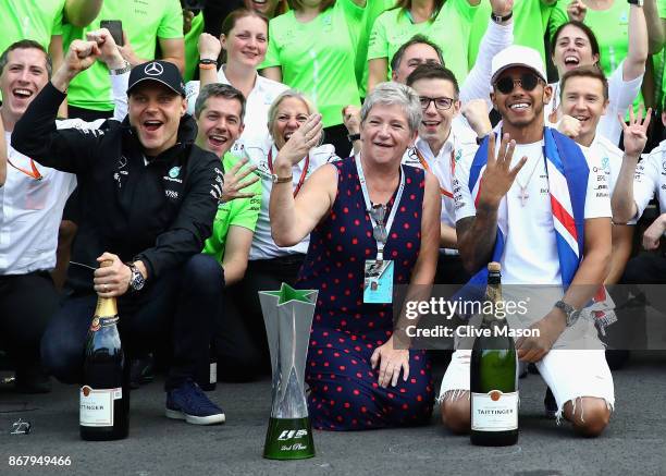 Lewis Hamilton of Great Britain and Mercedes GP celebrates with his mother Carmen Larbalestier after winning his fourth F1 World Drivers Championship...