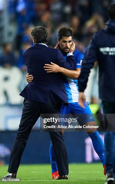 Head Coach of Malaga CF Michel Gonzalez celebrates after winning the match with Adrian Gonzalez of Malaga CF during the La Liga match between Malaga...