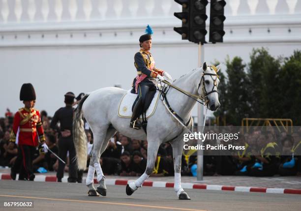 Thai people cry during a procession to transfer His Majesty the late King Bhumibol Adulyadejs royal relics and ashes from Phra Si Rattana Satsadaram...