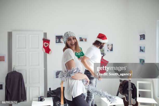 friends making christmas party - woman in guitar making studio stock pictures, royalty-free photos & images