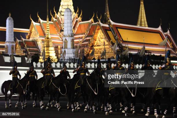 The king guard cavalry a procession to transfer His Majesty the late King Bhumibol Adulyadejs royal relics and ashes from Phra Si Rattana Satsadaram...