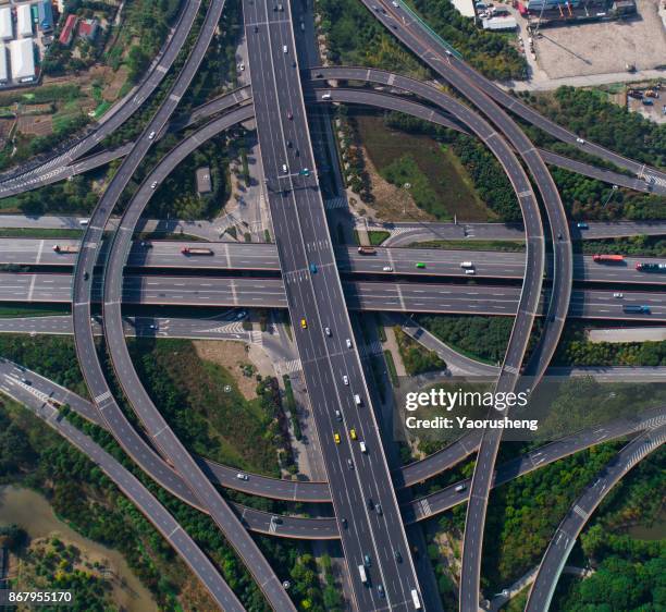 o ring shape overpass interchange freeway at shanghai,china (taken by drone) - stack_interchange stock pictures, royalty-free photos & images