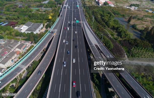 aerial view of the stack interchange at shanghai china,taken by drone - stack_interchange stock pictures, royalty-free photos & images