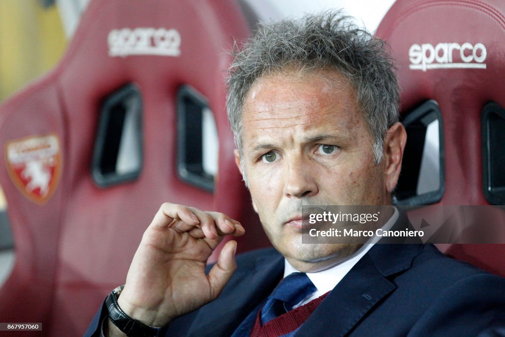 Sinisa Mihajlovic, head coach of Torino FC, looks on before...
