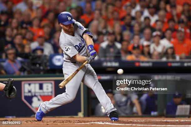 Logan Forsythe of the Los Angeles Dodgers hits a RBI single during the first inning against the Houston Astros in game five of the 2017 World Series...