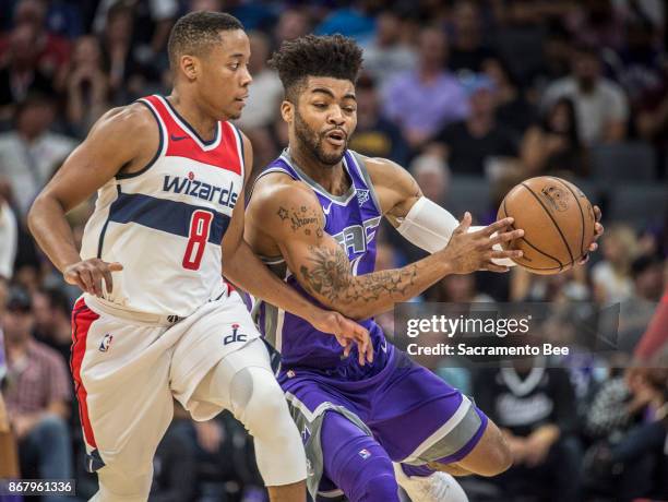 Sacramento Kings guard Frank Mason III attempts to control the ball against Washington Wizards guard Tim Frazier on Sunday, Oct. 29, 2017 at the...