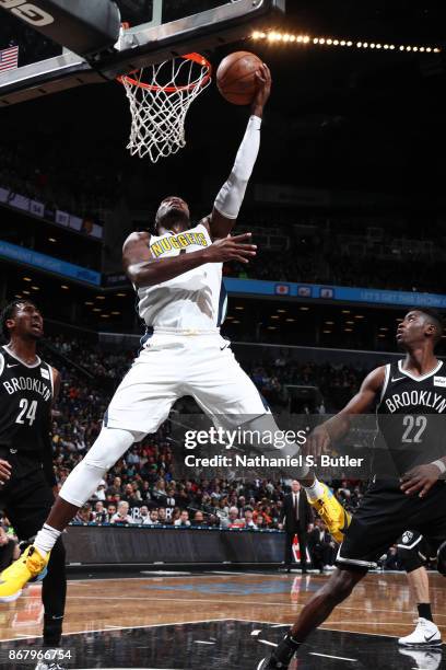 Paul Millsap of the Denver Nuggets drives to the basket against the Brooklyn Nets on October 29, 2017 at Barclays Center in Brooklyn, New York. NOTE...