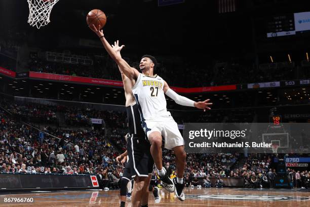 Jamal Murray of the Denver Nuggets drives to the basket against the Brooklyn Nets on October 29, 2017 at Barclays Center in Brooklyn, New York. NOTE...
