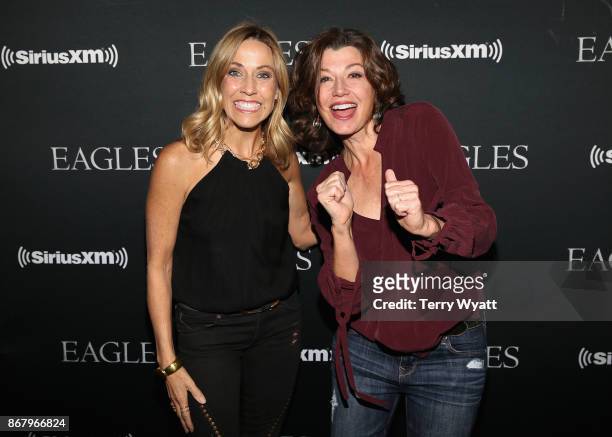 Sheryl Crow and Amy Grant attend SiriusXM presents the Eagles in their first ever concert at the Grand Ole Opry House on October 29, 2017 in...