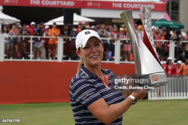 Cristie Kerr of the United States poses with the Sime Darby LPGA trophy after she won it by 15 under 269 during day four of the Sime Darby LPGA...