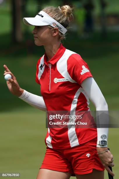 Nelly Korda of the United States reacts on sinking a birdie during day four of the Sime Darby LPGA Malaysia at TPC Kuala Lumpur East Course on...