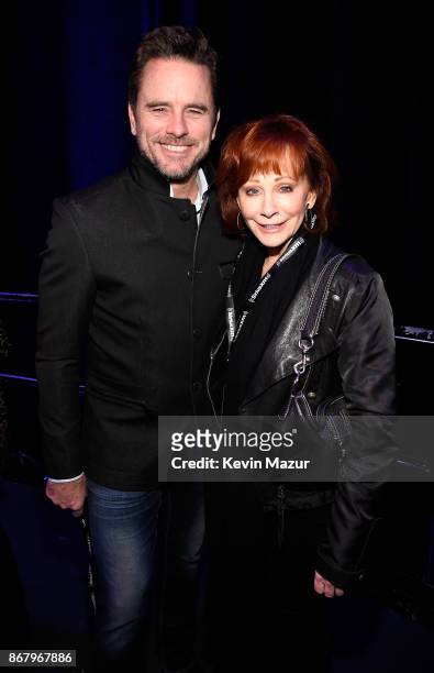 Charles Esten and Reba McEntire attend SiriusXM presents the Eagles in their first ever concert at the Grand Ole Opry House on October 29, 2017 in...