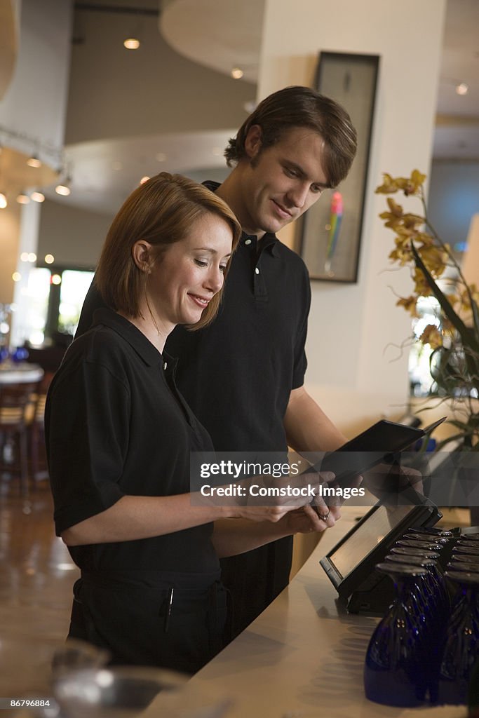 Restaurant staff reviewing menu