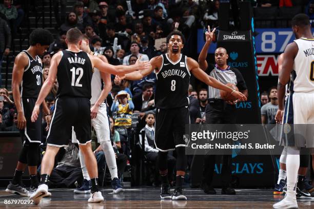 Spencer Dinwiddie of the Brooklyn Nets gives high five to Joe Harris of the Brooklyn Nets during the game against the Denver Nuggets on October 29,...