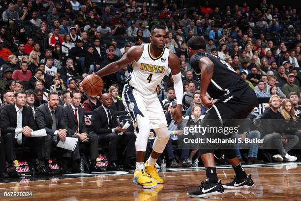 Paul Millsap of the Denver Nuggets handles the ball against the Brooklyn Nets on October 29, 2017 at Barclays Center in Brooklyn, New York. NOTE TO...
