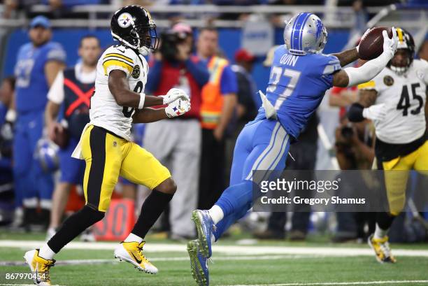 Free safety Glover Quin of the Detroit Lions makes a diving interception against the Pittsburgh Steelers during the first half at Ford Field on...