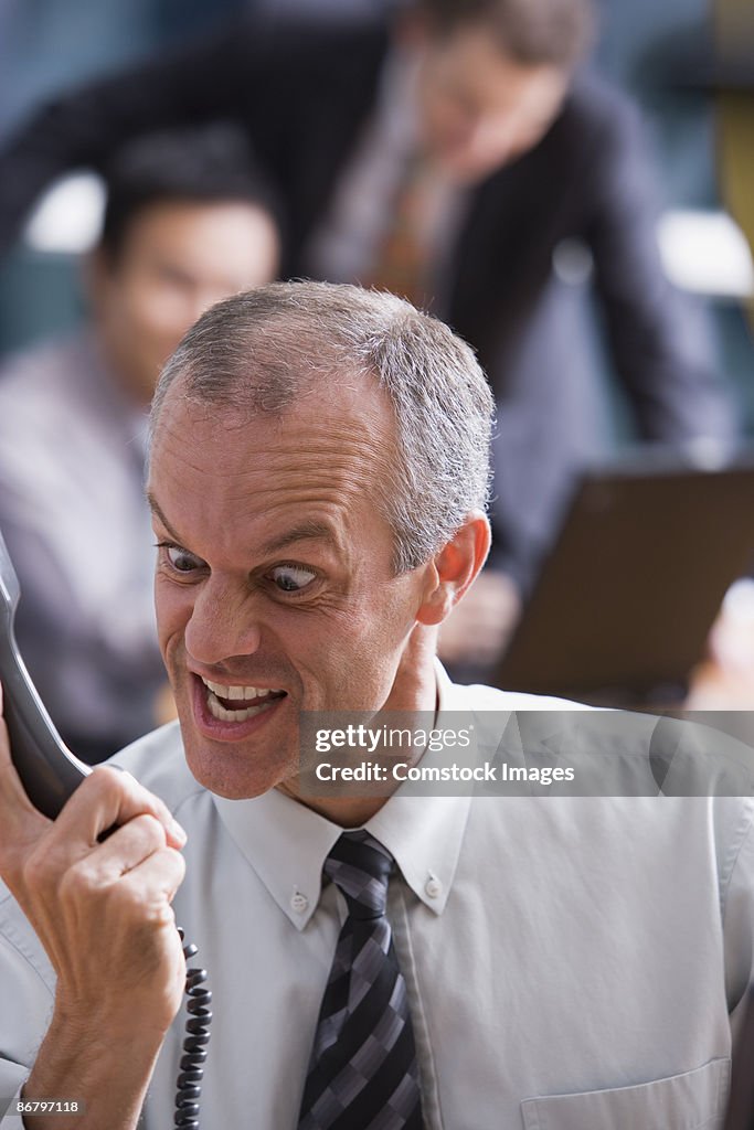 Man making faces at a phone