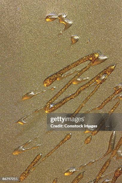 splatter on textured surface - syrup drizzle stock pictures, royalty-free photos & images