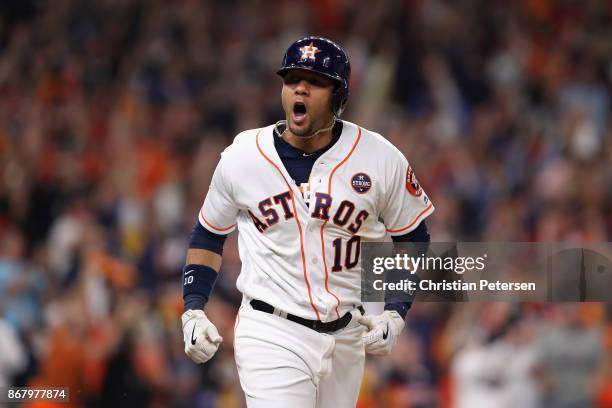 Yuli Gurriel of the Houston Astros celebrates after hitting a three run home run during the fourth inning against the Los Angeles Dodgers in game...