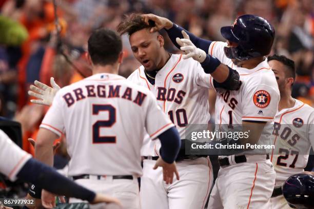 Yuli Gurriel of the Houston Astros celebrates after hitting a three run home run during the fourth inning against the Los Angeles Dodgers in game...