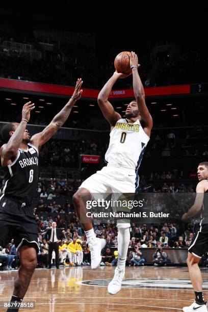 Emmanuel Mudiay of the Denver Nuggets shoots the ball against the Brooklyn Nets on October 29, 2017 at Barclays Center in Brooklyn, New York. NOTE TO...