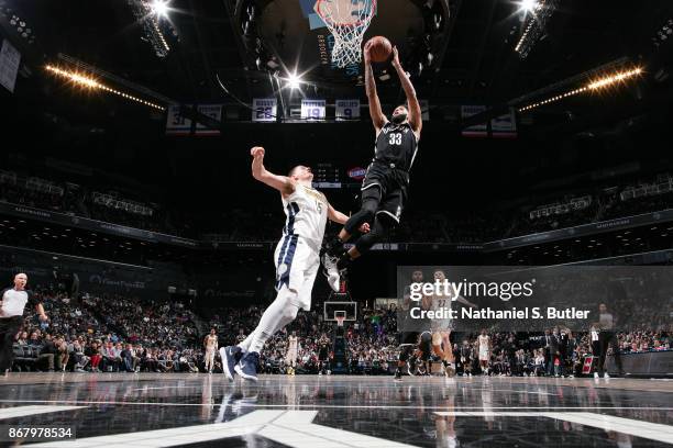 Allen Crabbe of the Brooklyn Nets drives to the basket against the Denver Nuggets on October 29, 2017 at Barclays Center in Brooklyn, New York. NOTE...