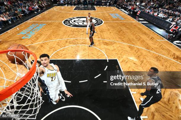 Jamal Murray of the Denver Nuggets drives to the basket against the Brooklyn Nets on October 29, 2017 at Barclays Center in Brooklyn, New York. NOTE...