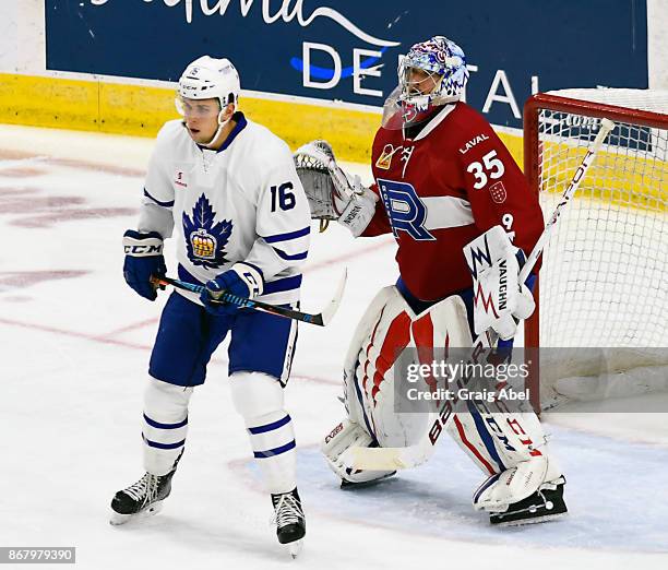 Kerby Rychel of the Toronto Marlies ""puts a screen on Charlie Lindgren of the Laval Rocket during AHL game action on October 28, 2017 at Ricoh...