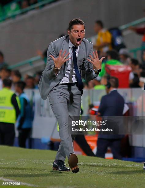 Diego Alonso, coach of Pachuca celebrates the second goal scored by Keisuke Honda during the 15th round match between Santos Laguna and Pachuca as...