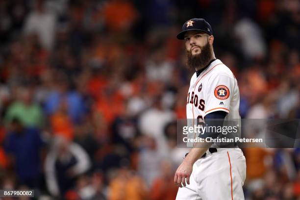 Dallas Keuchel of the Houston Astros walks off the field as he exits the game during the fourth inning against the Los Angeles Dodgers in game five...