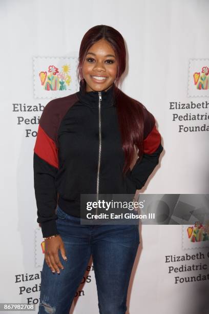 Gabby Douglas attends The Elizabeth Glaser Pediatric AIDS Foundation's 28th Annual 'A Time For Heroes' Family Festival at Smashbox Studios on October...