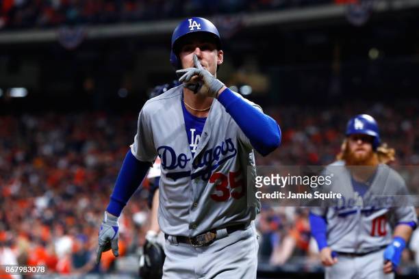 Cody Bellinger of the Los Angeles Dodgers gestures after hitting a three-run home run during the fifth inning against the Houston Astros in game five...