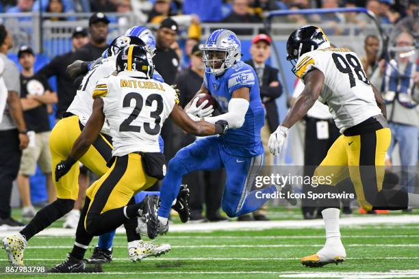 Detroit Lions running back Dwayne Washington catches a pass and makes a big gain with Pittsburgh Steelers free safety Mike Mitchell and Pittsburgh...