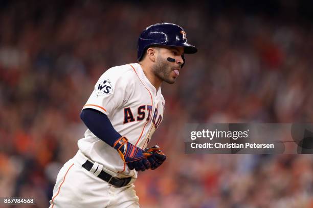 Jose Altuve of the Houston Astros reacts after hitting a three-run home run during the fifth inning against the Los Angeles Dodgers in game five of...
