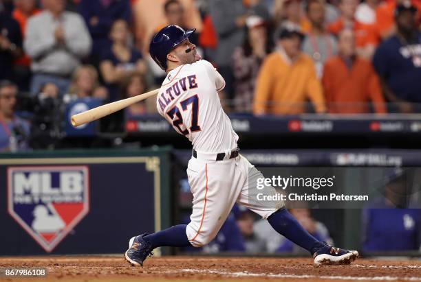 Jose Altuve of the Houston Astros hits a three run home run during the fifth inning against the Los Angeles Dodgers in game five of the 2017 World...