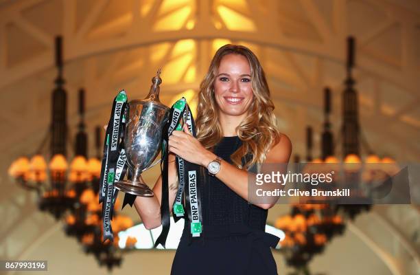 Champion Caroline Wozniacki of Denmark poses with the Billie Jean King trophy after her victory against Venus Williams of the United States in the...
