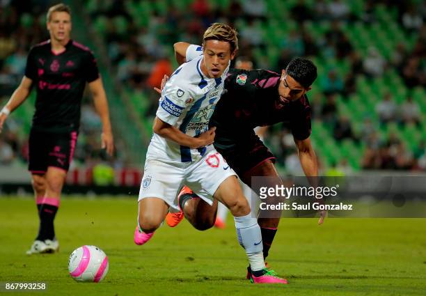 Keisuke Honda of Pachuca and Diego de Buen of Santos fight for the ball during the 15th round match between Santos Laguna and Pachuca as part of the...