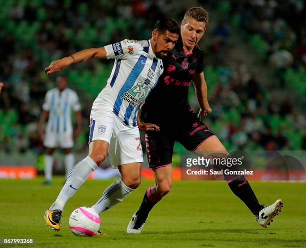 Franco Jara of Pachuca and Julio Furch of Santos fight for the ball during the 15th round match between Santos Laguna and Pachuca as part of the...