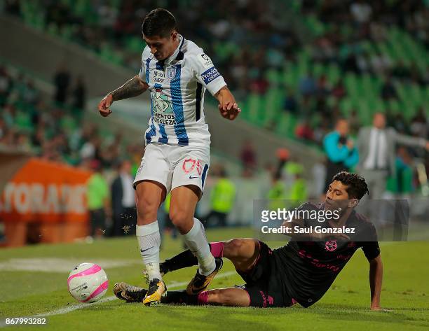 Victor Guzman of Pachuca and Gerardo Arteaga of Santos vie for the ball during the 15th round match between Santos Laguna and Pachuca as part of the...