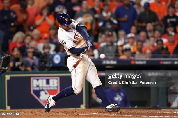 George Springer of the Houston Astros hits a solo home run during the seventh inning against the Los Angeles Dodgers in game five of the 2017 World...