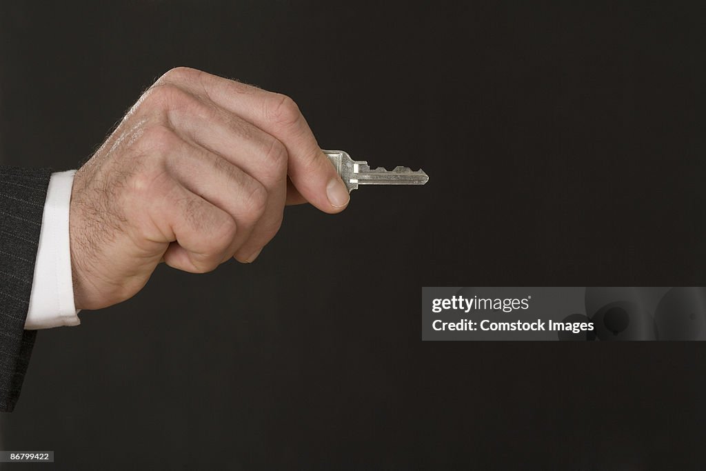 Hand holding a key