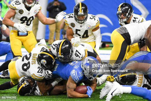 Detroit Lions running back Dwayne Washington runs into Pittsburgh Steelers nose tackle Javon Hargrave and Pittsburgh Steelers defensive end Cameron...
