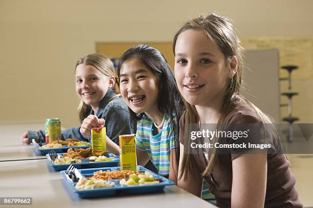 girls eating lunch - school cafeteria line stock pictures, royalty-free photos & images