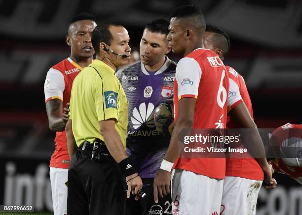 Referee Luis Sanchez, argues with William Tesillo during the match between Independiente Santa Fe and La Equidad as part of the 17th round of the...