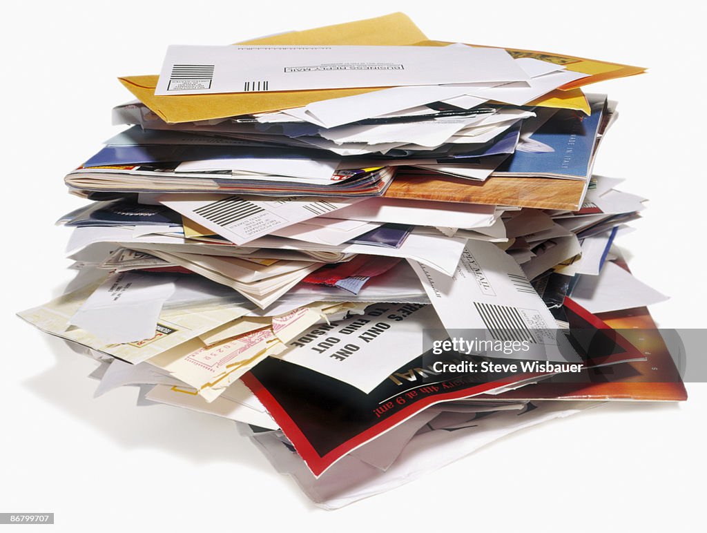 Pile of unwanted bills and junk mail to recycle